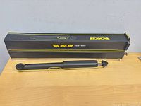 Boxed Monroe Restore shock absorber with one unit displayed