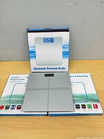 Scale positioned on two boxed scales, showing design and packaging