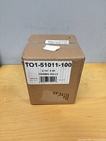 Closed carton labeled TO1-51011-100