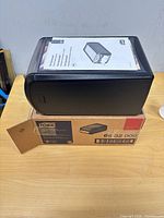 Black Tork Xpressnap dispenser on its original box