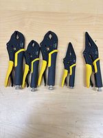 All five ARU locking pliers laid out showing size range and grips