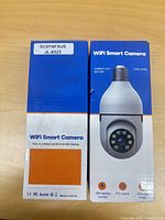 Front of box showing WiFi Smart Camera product image and features