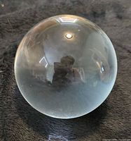 glass sphere on fabric background