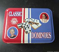 metal tin lid with Classic Dominoes branding