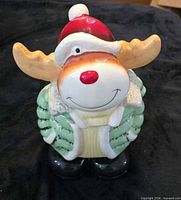 Front view of reindeer cookie jar with lid on