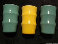 Front view of all three tumblers displaying color and bamboo-ribbed shape