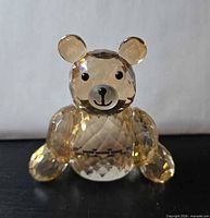 Front view of faceted amber crystal teddy bear figurine