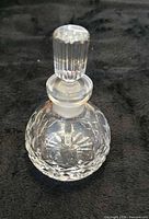 Perfume bottle with stopper assembled showing cut pattern
