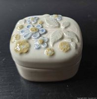 Top view of closed box showing raised floral design