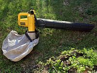 Full view of Yard Pro YP 385 blower with attached collection bag on grass