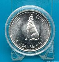 Reverse of 1967 50-cent coin showing howling wolf design in capsule