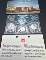 Front view of pliofilm-sealed 6-coin set with COA and envelope