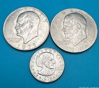 Group shot of all three $1 coins obverse side