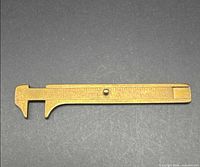 Full view of brass caliper