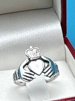 Front view of sterling silver Claddagh ring in box