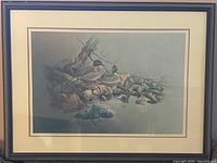 Full view of framed print under glass