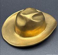 Top view showing brass cowboy hat shape
