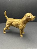 Full side view of brass dog figurine