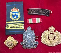 All six military insignia items arranged on red background