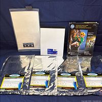 All items overview: five Rayzist packs and HP photo paper box