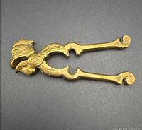 Full view of brass rooster nutcracker closed