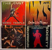 Group shot of four vinyl record jackets