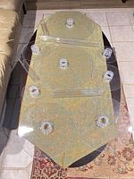 All plates and cylinder supports displayed on table