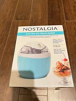 Front view of boxed Nostalgia ICM500BLUE ice cream maker