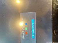 Monitor powered on showing “Check Signal Cable” box