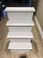 Front angled view showing all three steps and paint wear