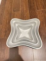 Three nesting pans stacked