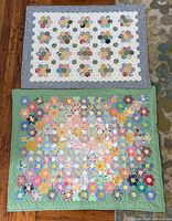 Overall view of both quilts showing size, borders, colours