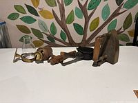 All four antique items lined up on table