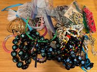Overall lot spread showing variety of bead necklaces, bracelets, earrings and bagged components