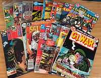 Front view showing majority of war comics spread out