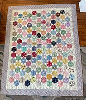 Full view of handmade hexagon patchwork quilt