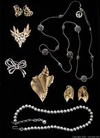 All eight jewellery types laid out on black background