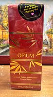 Front view of sealed Yves Saint Laurent Opium 100 ml box