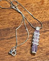 Necklace laid out showing chain, clasp, and pendant