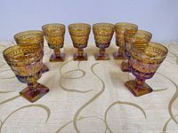 Front view of all eight amber carnival goblets