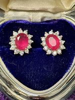 Front view of both earrings in presentation box