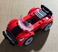 Angled top view of assembled red LEGO sports car