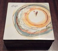 Top view showing ceramic insert design and word Hope