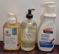 Front view of the three unopened pump bottles: Nature Clean hand soap, The Bare Home dish soap, Palmer's lotion