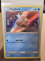 Front of Magikarp holographic card in sleeve