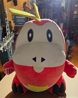 Front view of Fuecoco Build-A-Bear plush showing facial details and tag