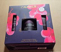 Front of sealed Caudalie Premier Cru gift box showing branding and $155 value sticker