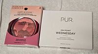 Front view of sealed Physicians Formula blush and PUR eyeshadow palette boxes