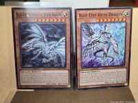 Both cards in sleeves, front view