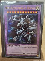 Front of Blue-Eyes Ultimate Dragon card in sleeve